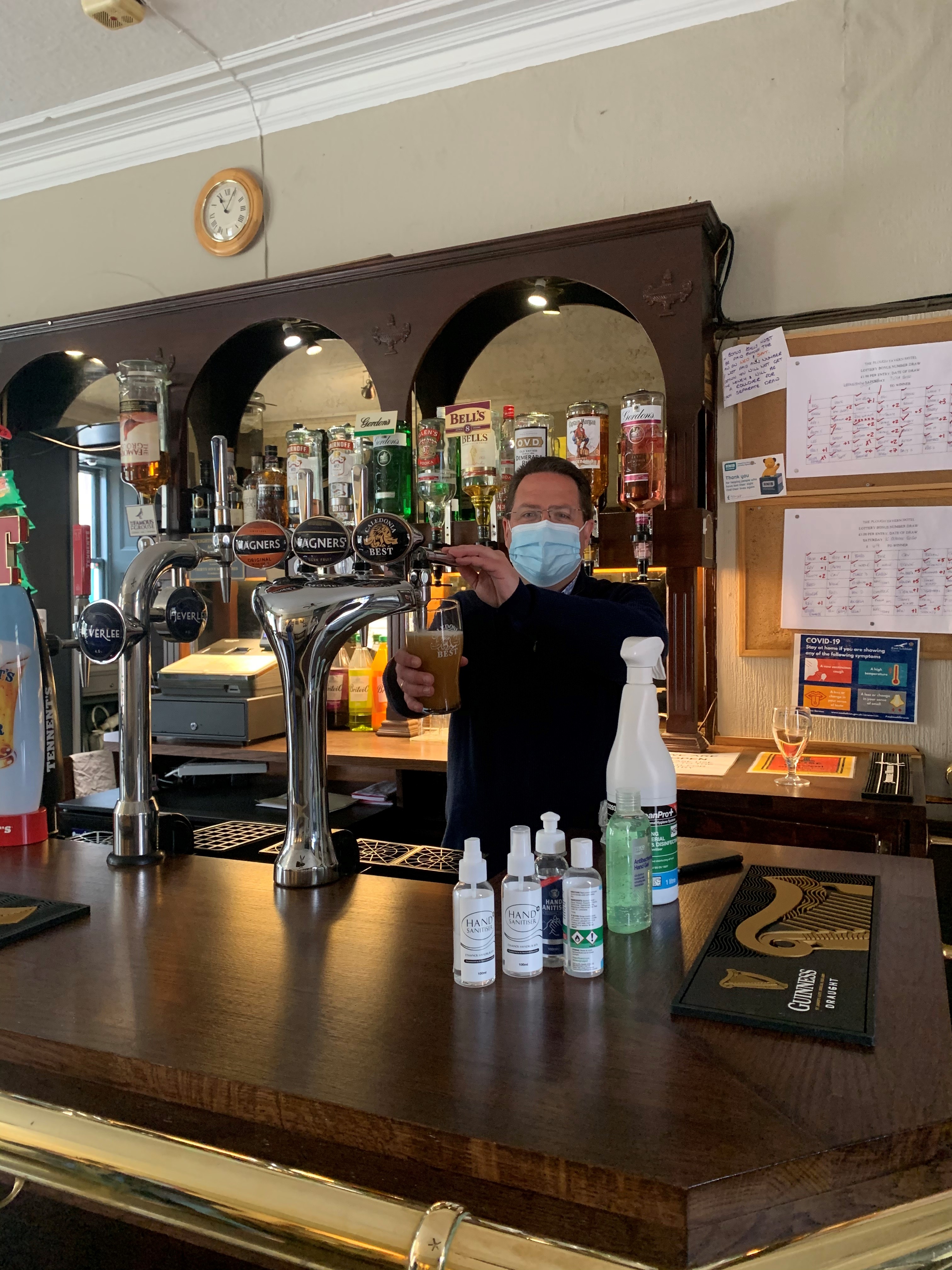 Craig Hoy MSP pulling pints at the Plough Inn, Haddington